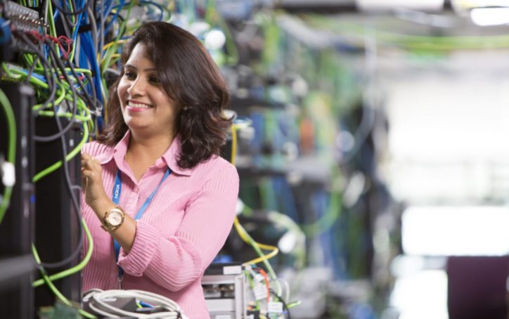 Young woman in high-tech communications lab